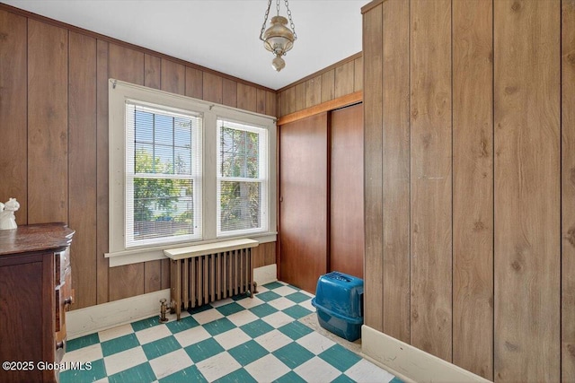 5 Hillview Ave, East Greenbush, NY 12144 - spare room with radiator heating unit, tile patterned floors, and wood walls