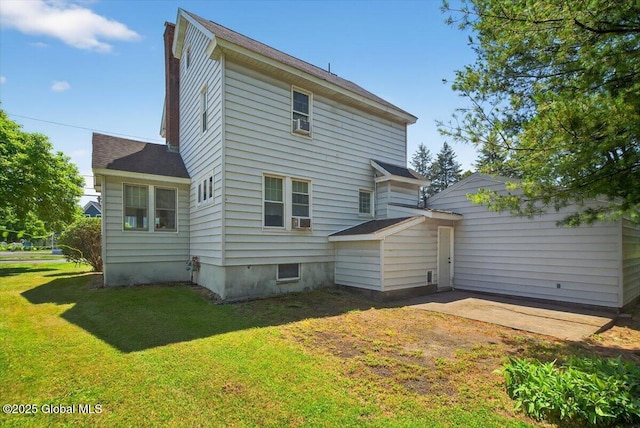 5 Hillview Ave, East Greenbush, NY 12144 - rear view of house with a yard, a chimney, cooling unit, and roof with shingles