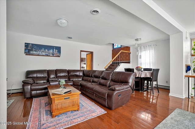 1576 State St, Schenectady, NY 12304 - living area featuring stairs, baseboard heating, and hardwood / wood-style floors