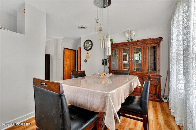 1576 State St, Schenectady, NY 12304 - dining room with light wood finished floors and baseboards