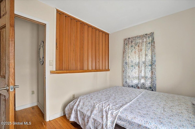 1576 State St, Schenectady, NY 12304 - bedroom with light wood-type flooring and baseboards