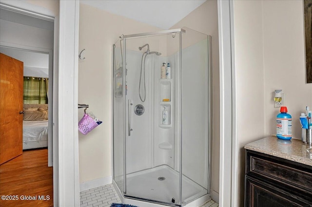 1576 State St, Schenectady, NY 12304 - bathroom with ensuite bath, a stall shower, and wood finished floors
