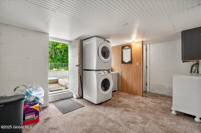 1576 State St, Schenectady, NY 12304 - washroom featuring stacked washer and clothes dryer and concrete block wall