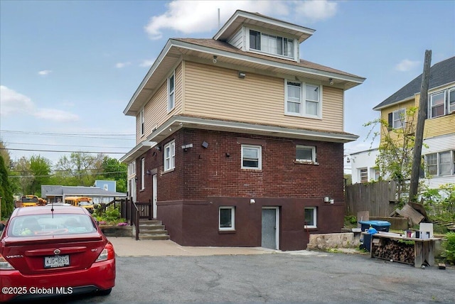 1576 State St, Schenectady, NY 12304 - view of home's exterior with brick siding and fence