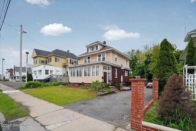 1576 State St, Schenectady, NY 12304 - traditional style home featuring a front yard and a residential view