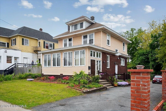 1576 State St, Schenectady, NY 12304 - traditional style home with a front lawn and a chimney