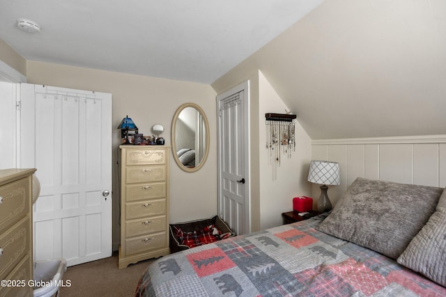 bedroom featuring carpet and vaulted ceiling