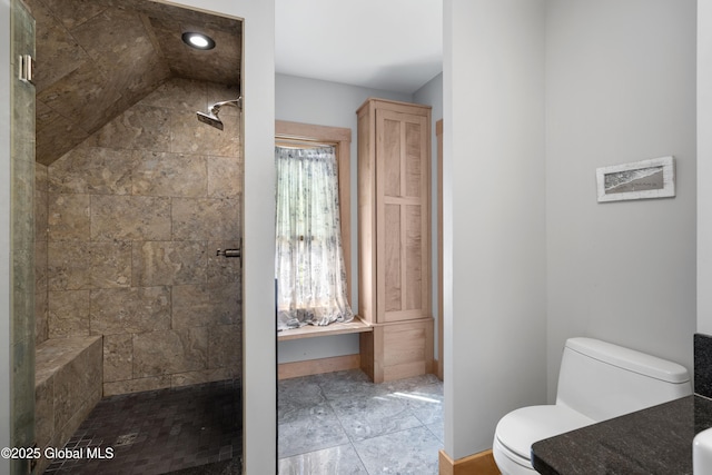 full bathroom with toilet, a tile shower, and recessed lighting