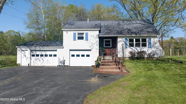 188 Fort Edward Rd, Moreau, NY 12828 - split level home with driveway, a front lawn, a shingled roof, and an attached garage