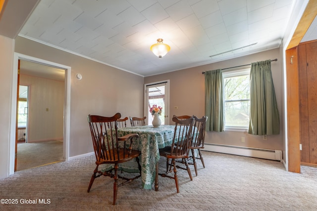 188 Fort Edward Rd, Moreau, NY 12828 - dining area featuring a baseboard radiator, carpet floors, crown molding, and baseboards