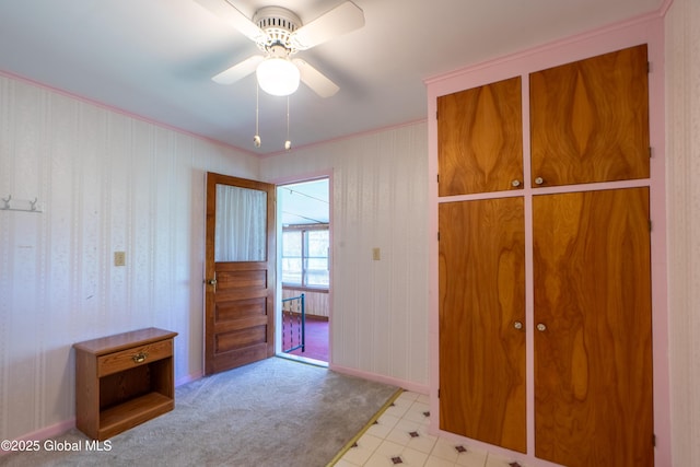 188 Fort Edward Rd, Moreau, NY 12828 - unfurnished bedroom featuring baseboards and a ceiling fan