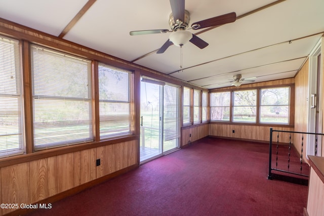 188 Fort Edward Rd, Moreau, NY 12828 - unfurnished sunroom with wooden walls, carpet, and baseboards