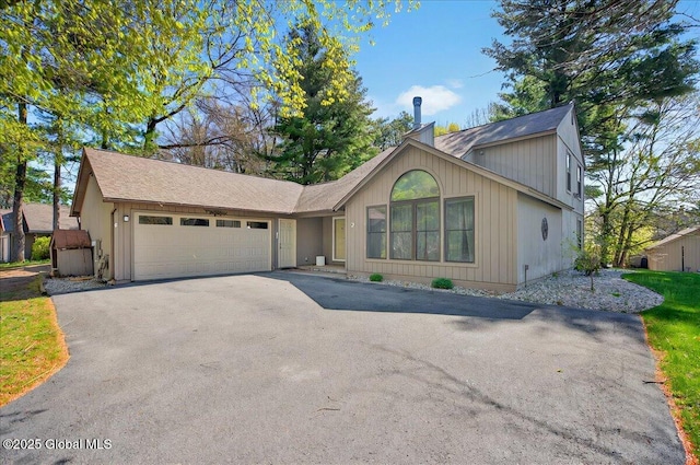 view of front of house featuring an attached garage and driveway