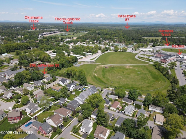 295 Jefferson St, Saratoga Springs, Inside, NY 12866 - aerial view of property and surrounding area featuring nearby suburban area and a forest