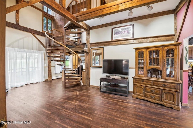 11 Cotton Ct, Bolton, NY 12824 - living room featuring a high ceiling, stairs, wood finished floors, plenty of natural light, and beam ceiling
