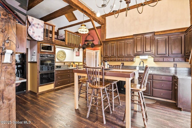 11 Cotton Ct, Bolton, NY 12824 - kitchen featuring high vaulted ceiling, a chandelier, stainless steel microwave, beam ceiling, and dark wood finished floors