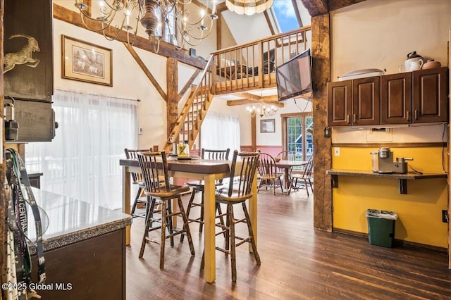 11 Cotton Ct, Bolton, NY 12824 - dining room featuring a chandelier, a high ceiling, and dark wood-type flooring