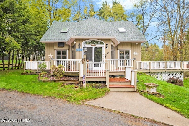 11 Cotton Ct, Bolton, NY 12824 - bungalow-style home with roof with shingles and a wooden deck