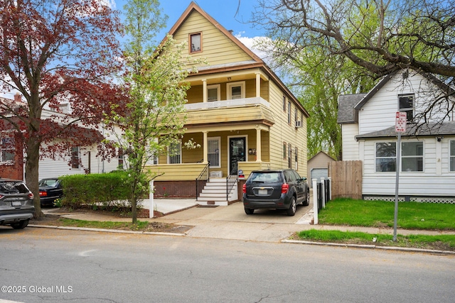 1108 Cutler St, Schenectady, NY 12303 - view of front facade featuring covered porch, fence, a garage, and a balcony