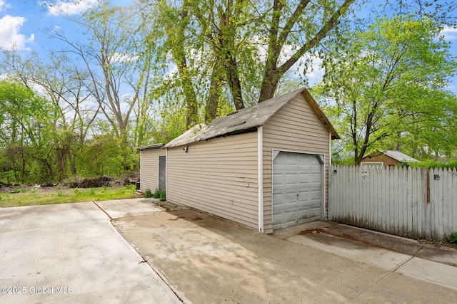 1108 Cutler St, Schenectady, NY 12303 - detached garage featuring driveway and fence