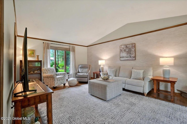 living room with crown molding, vaulted ceiling, and wood finished floors