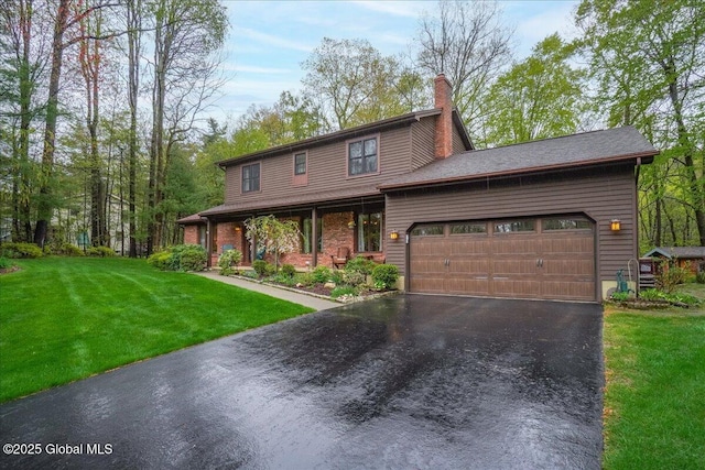 view of front of property featuring a garage, a front lawn, a chimney, and driveway
