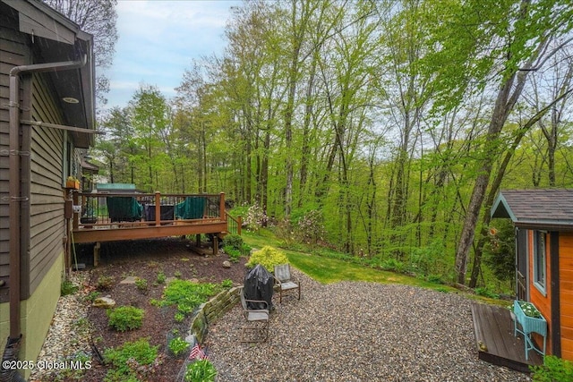 view of yard featuring a wooden deck