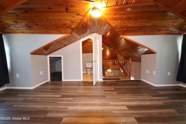 additional living space featuring wooden ceiling, wood finished floors, vaulted ceiling, and baseboards