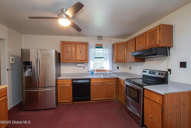 kitchen featuring stainless steel appliances, a sink, under cabinet range hood, brown cabinets, and light countertops