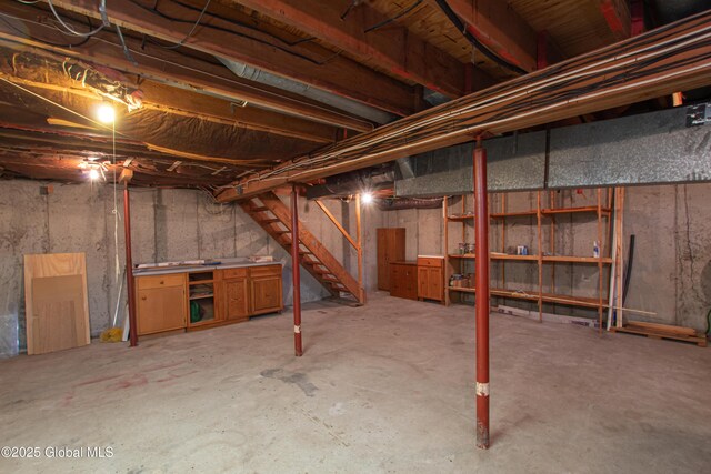 unfinished basement with stairway