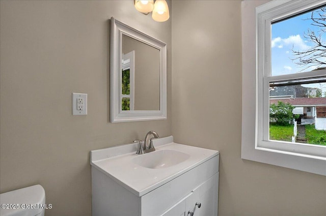 bathroom featuring vanity and toilet