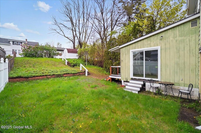 view of yard featuring entry steps