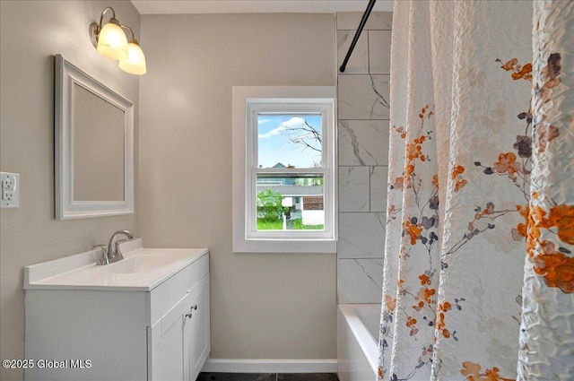 full bath with vanity, baseboards, and shower / bathtub combination with curtain