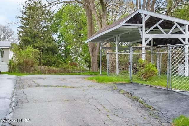 view of parking / parking lot with fence