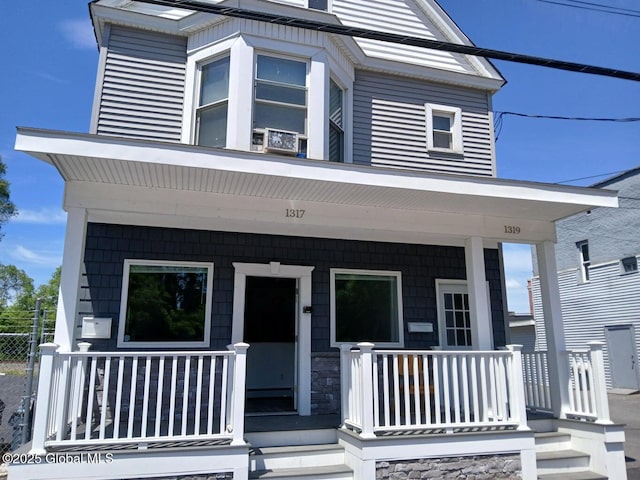 1317 Lower Broadway, Schenectady, NY 12306 - view of front facade featuring a porch and fence