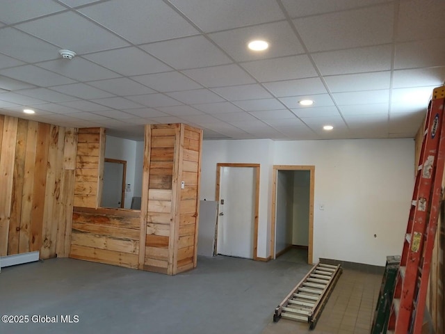 1317 Lower Broadway, Schenectady, NY 12306 - unfurnished room featuring wood walls, a smoke detector, recessed lighting, a paneled ceiling, and concrete flooring