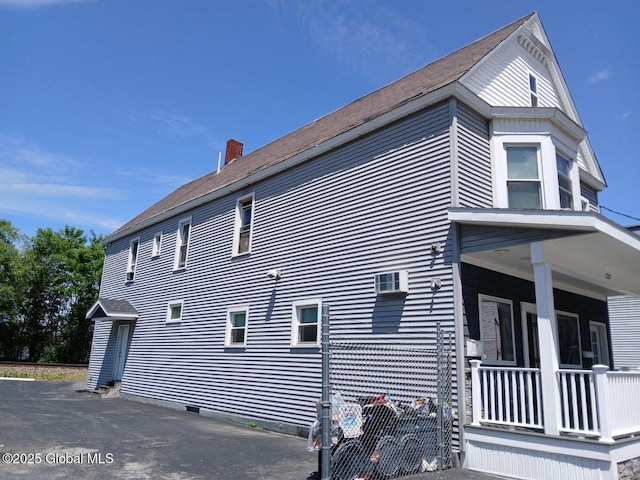 1317 Lower Broadway, Schenectady, NY 12306 - view of home's exterior with a chimney and covered porch