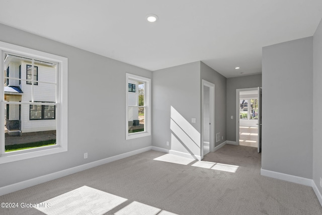 unfurnished room featuring baseboards, carpet flooring, and recessed lighting