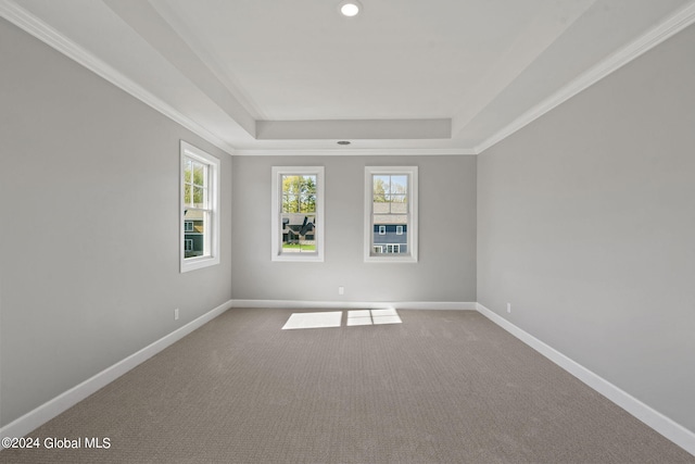 unfurnished room with a tray ceiling, baseboards, carpet flooring, and recessed lighting