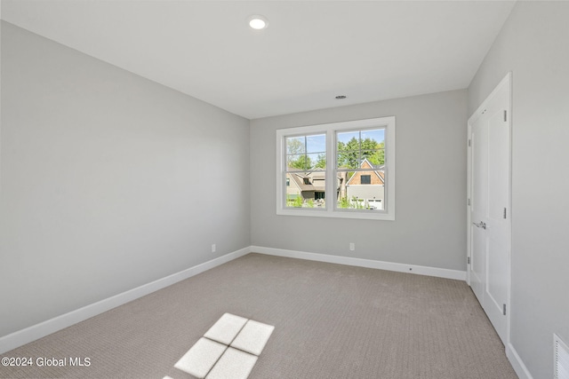 unfurnished bedroom with carpet floors, baseboards, and recessed lighting