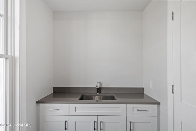 bar featuring a sink