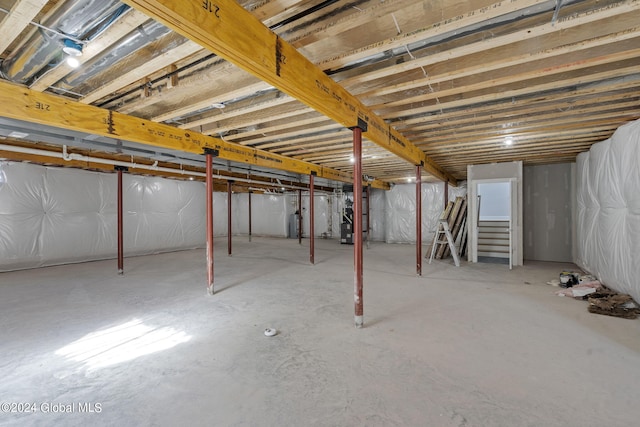 unfinished below grade area featuring stairway