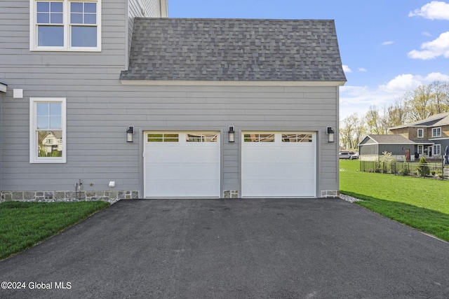 garage with asphalt driveway