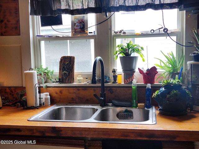 room details with light countertops and a sink