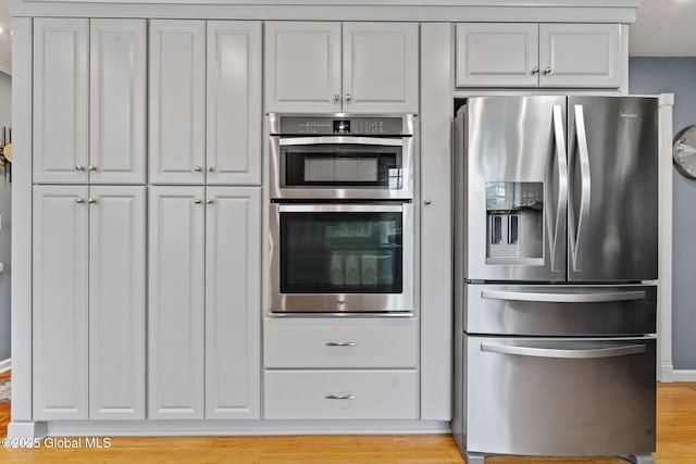 228 Maura Ln, Glenville, NY 12302 - kitchen featuring stainless steel appliances and light wood-type flooring