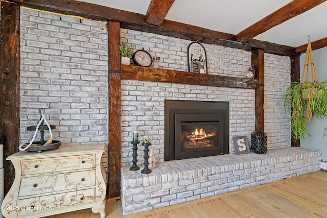 228 Maura Ln, Glenville, NY 12302 - detailed view of beam ceiling, wood finished floors, and a brick fireplace