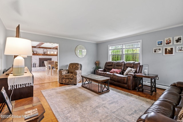 228 Maura Ln, Glenville, NY 12302 - living area featuring a baseboard heating unit, a chandelier, and ornamental molding