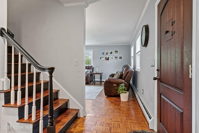 228 Maura Ln, Glenville, NY 12302 - entrance foyer featuring a baseboard radiator, ornamental molding, baseboards, and stairs