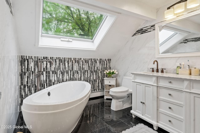 228 Maura Ln, Glenville, NY 12302 - bathroom with tile walls, granite tiled floors, healthy amount of natural light, toilet, and vanity