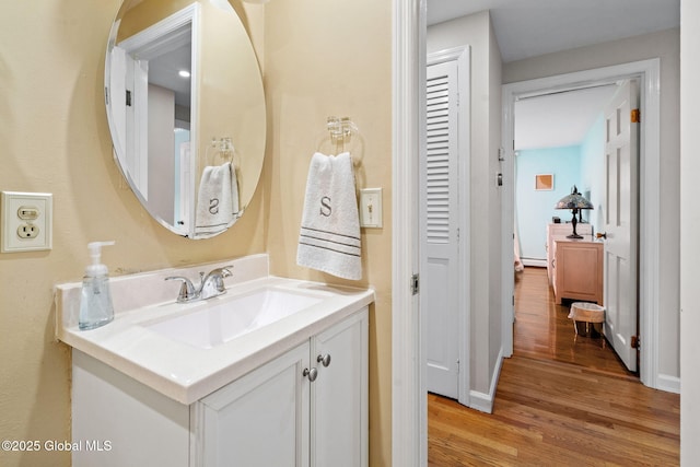 228 Maura Ln, Glenville, NY 12302 - bathroom featuring wood finished floors, vanity, and baseboards